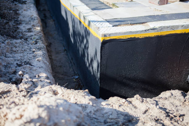 Professional Waterproofing technician working in Dunlap, OH